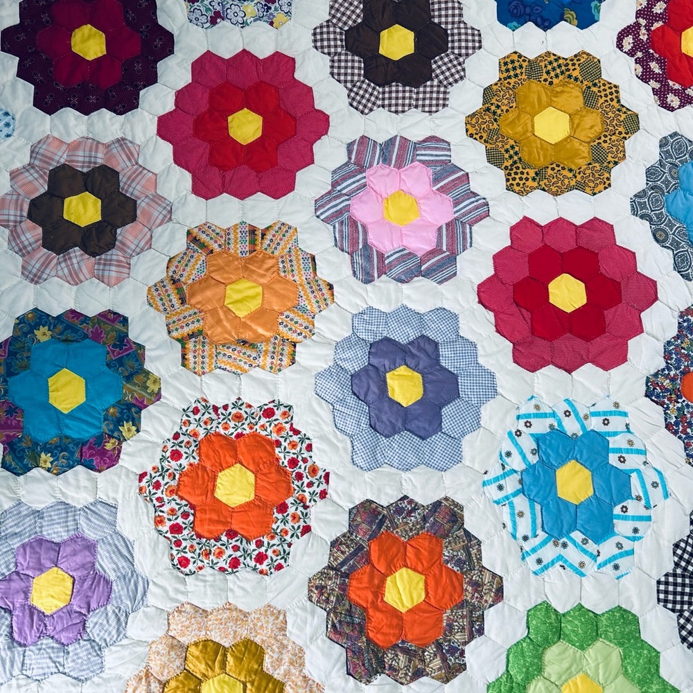 Colorful grandmother‘s flower garden vintage Quilt